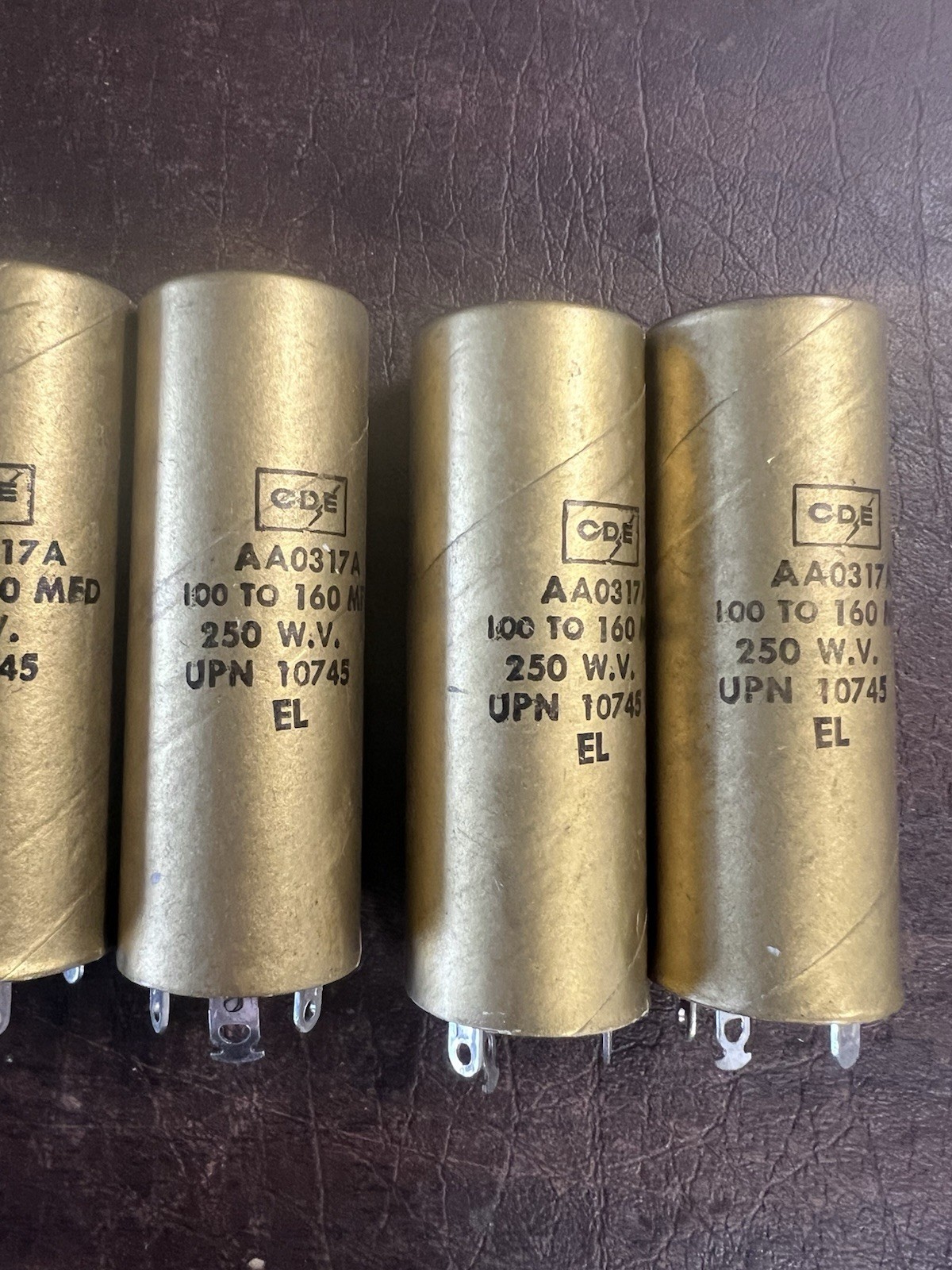 Lot of 7 Vintage CDE Cornell-Dubilier AA0317A Gold Capacitors 100-160 MFD NOS