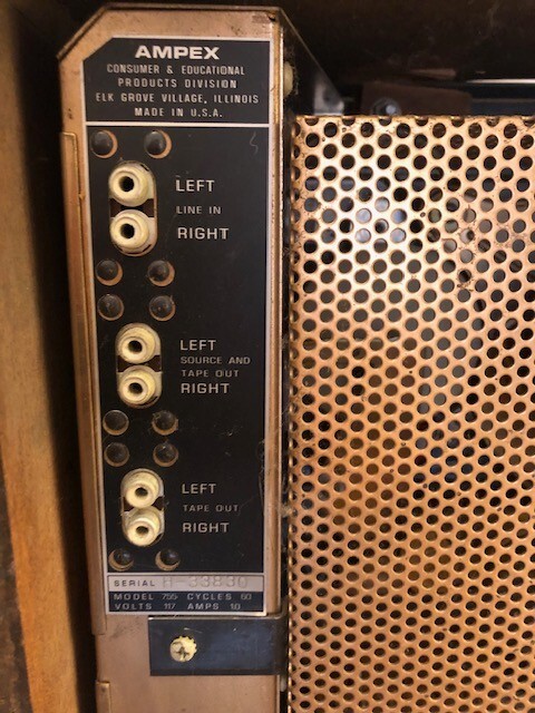 Ampex Model 55 reel-to-reel tape recorder in wooden housing.