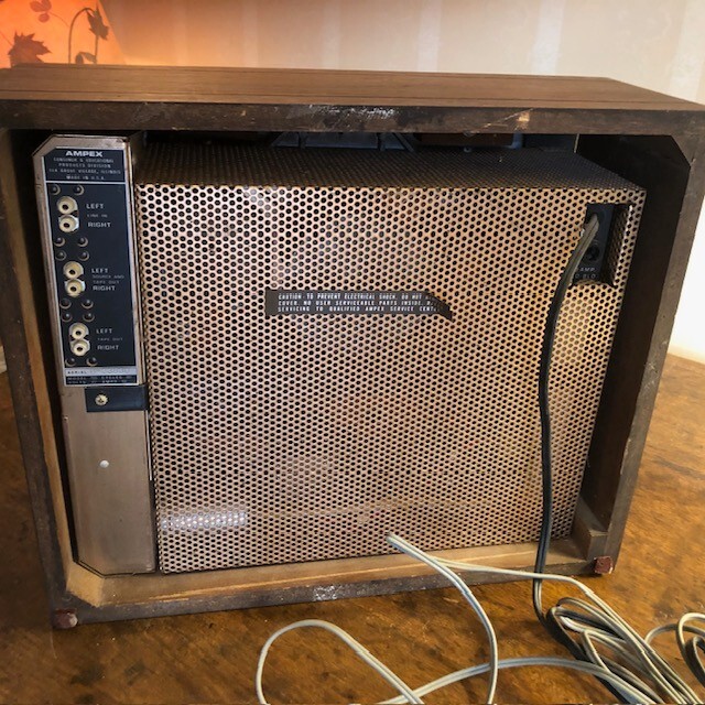 Ampex Model 55 reel-to-reel tape recorder in wooden housing.