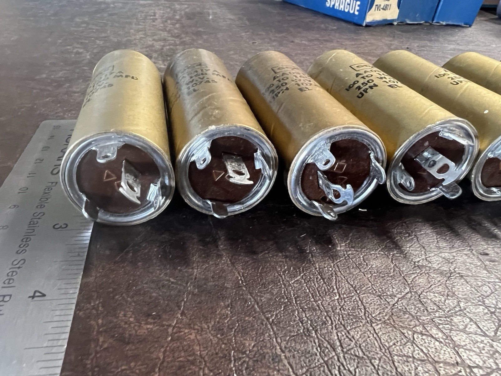 Lot of 7 Vintage CDE Cornell-Dubilier AA0317A Gold Capacitors 100-160 MFD NOS