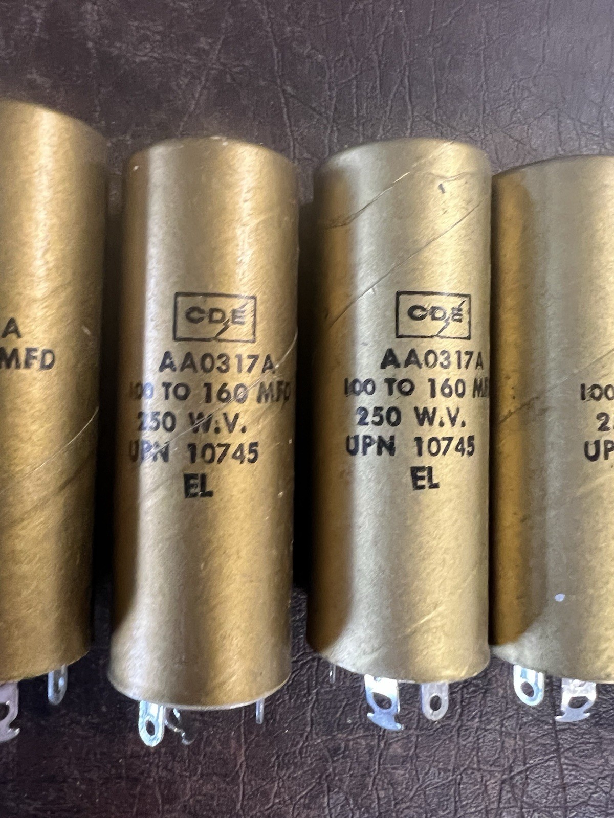 Lot of 7 Vintage CDE Cornell-Dubilier AA0317A Gold Capacitors 100-160 MFD NOS