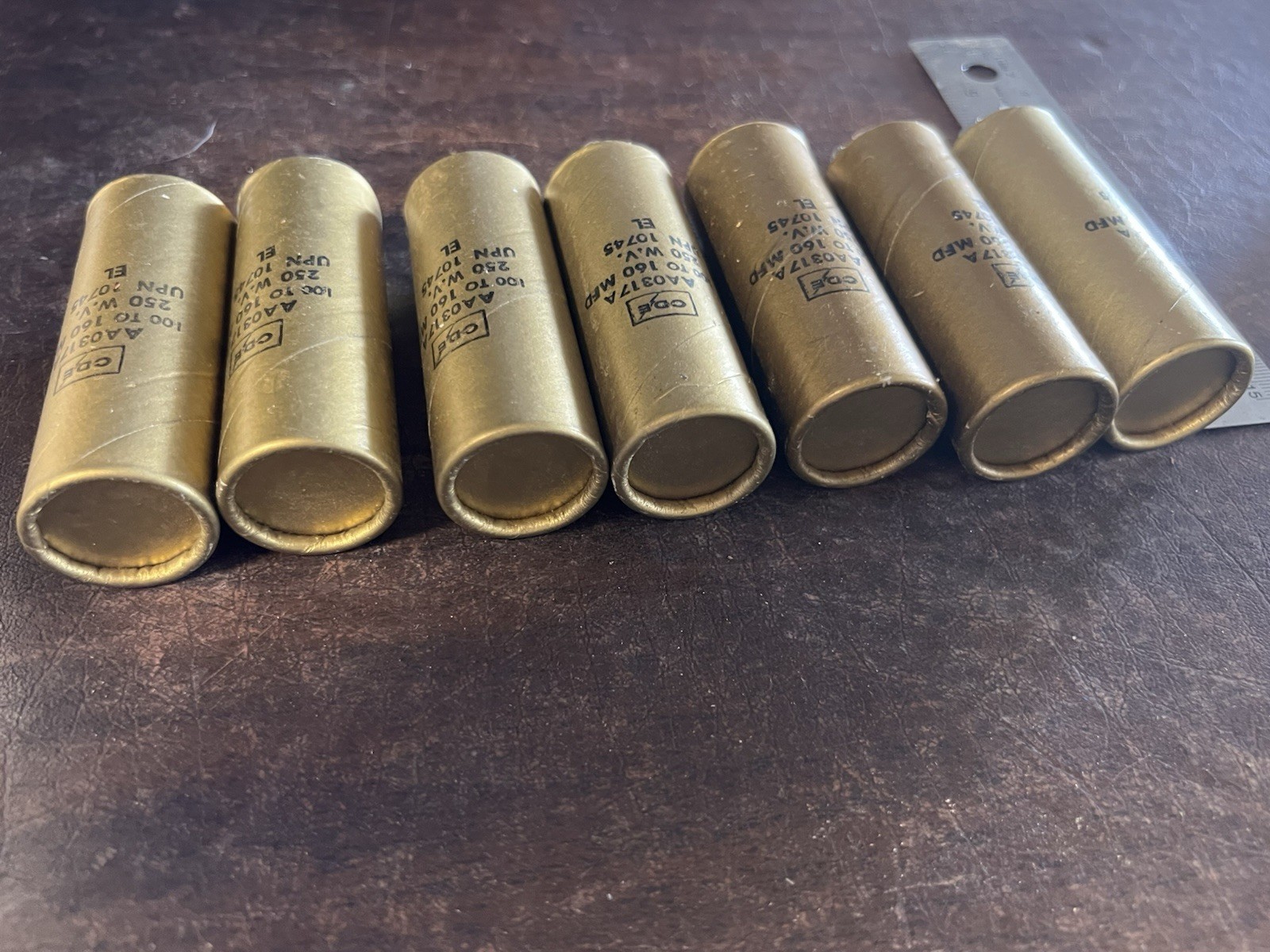 Lot of 7 Vintage CDE Cornell-Dubilier AA0317A Gold Capacitors 100-160 MFD NOS